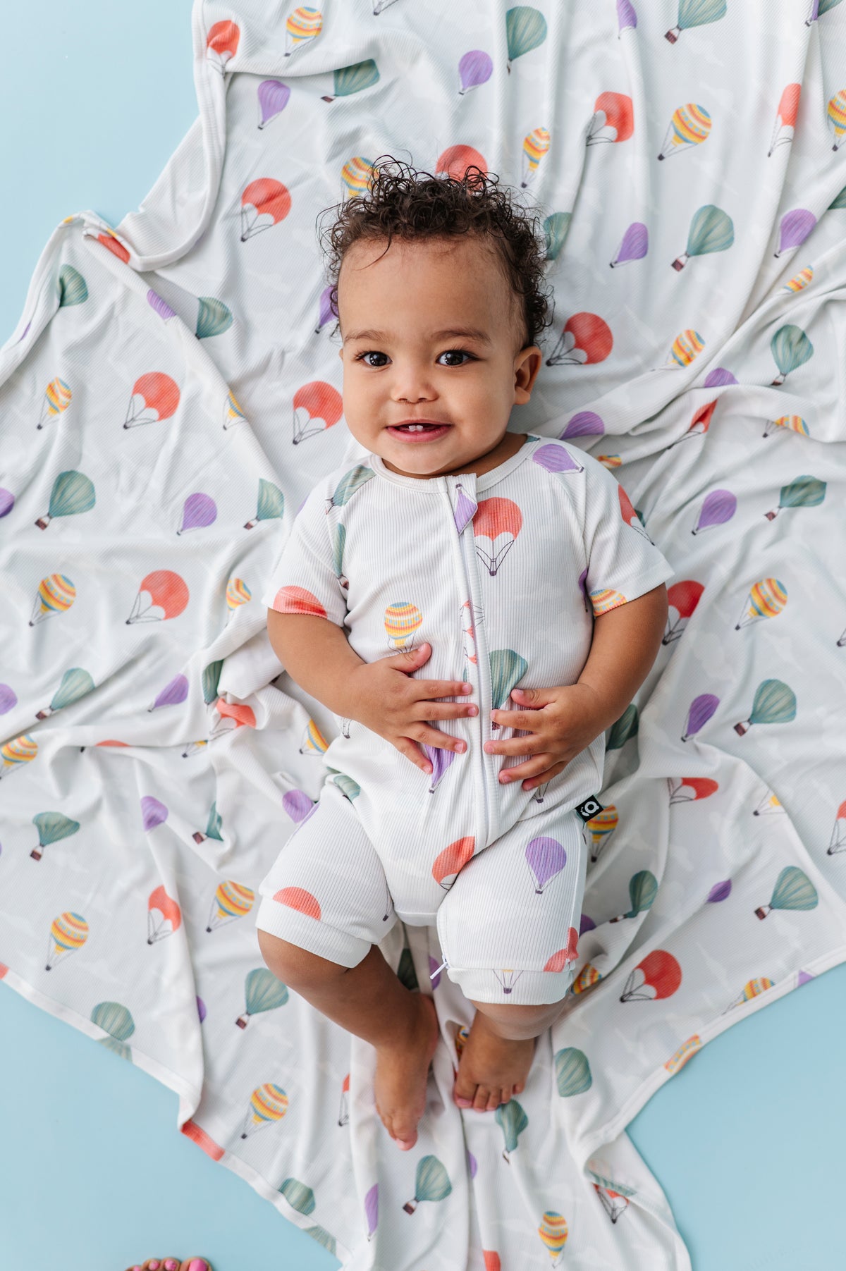 Hugs & Giggles bamboo baby shorty zip romper