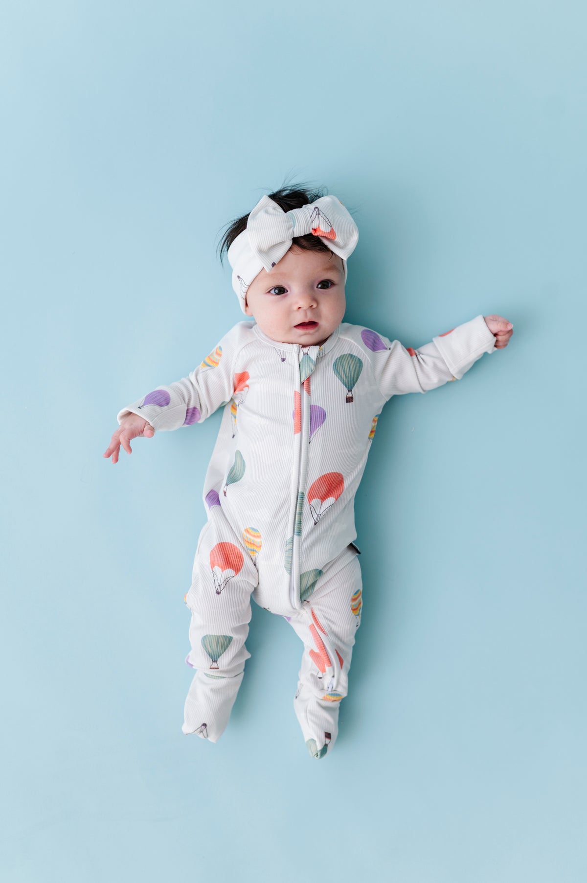 Hugs & Giggles bamboo baby zip romper with matching knotted beanie